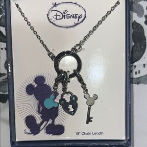 Disney Silver Charm Necklace with Blue Accents. New in the box